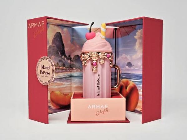 Pink ice cream-themed perfume bottle with decorative elements in an open Armaf box.