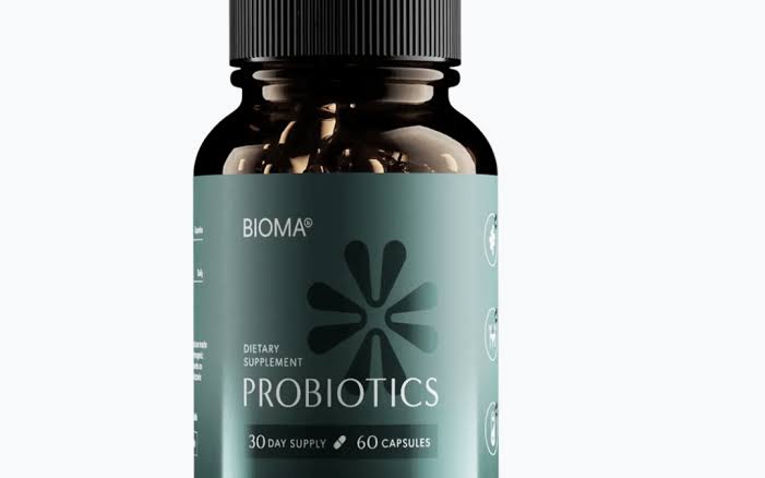 A bottle of BIOMA Probiotics dietary supplement, featuring a dark amber glass bottle with a black cap and a muted teal-green label, set against a plain white background.